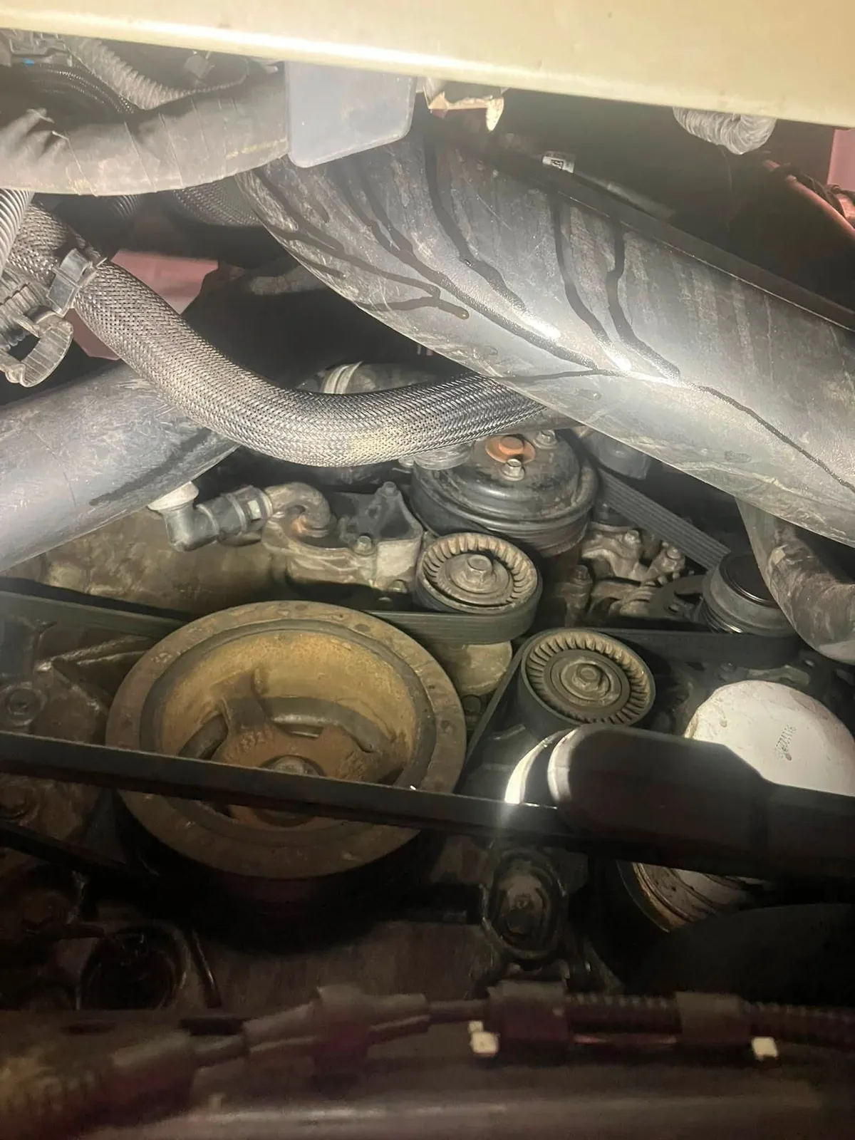 Drive belt replacement — tensioner and idler pulleys.